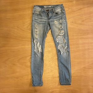 Machine denim size 0, USA size 25 - 97% cotton and 3% spandex